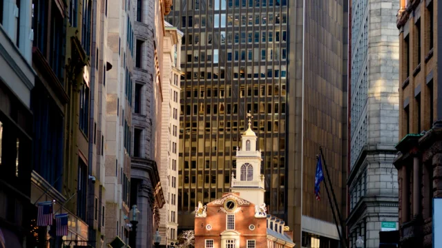 A city street with old buildings and a clock tower