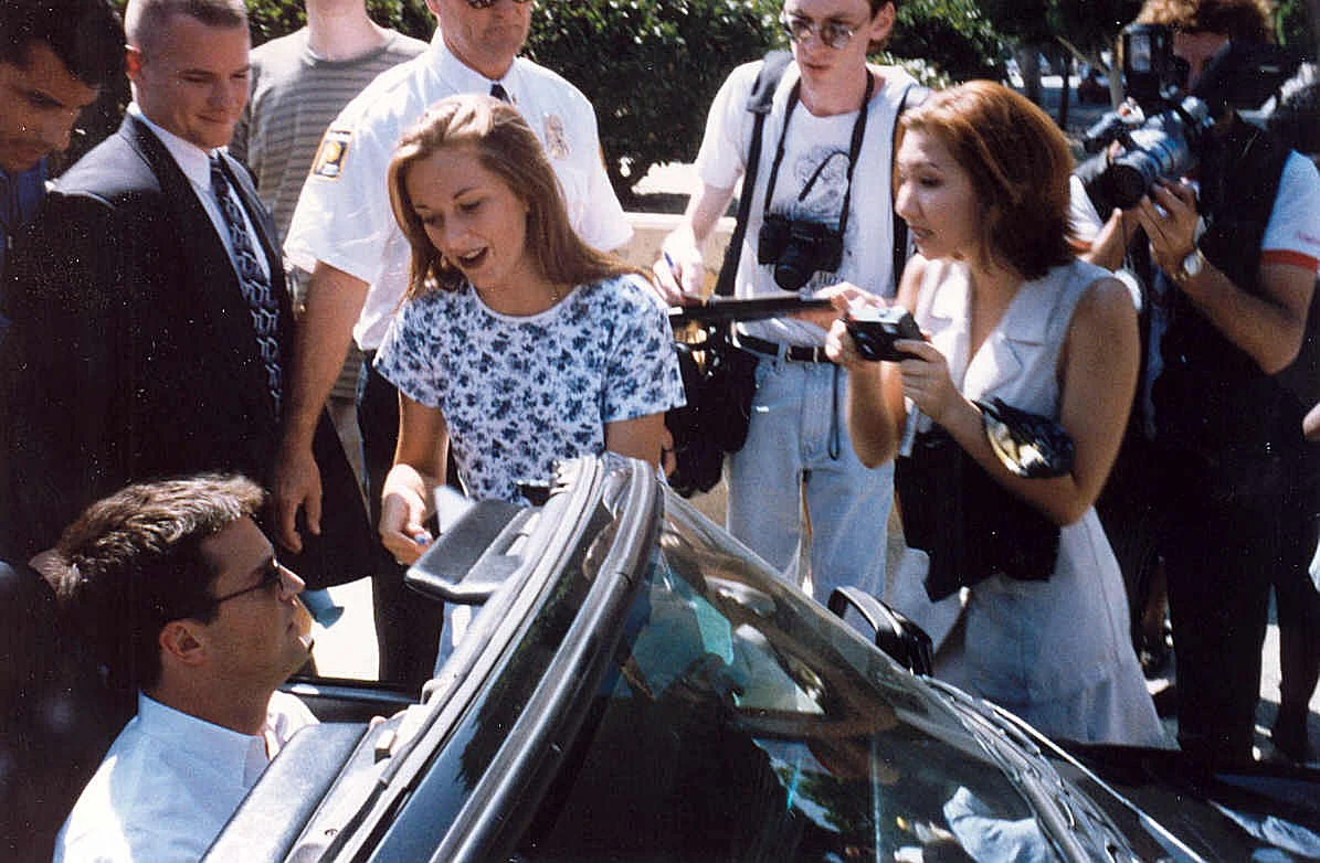 Actor Matthew Perry pictured in September 1995, surrounded by fans and paparazzi